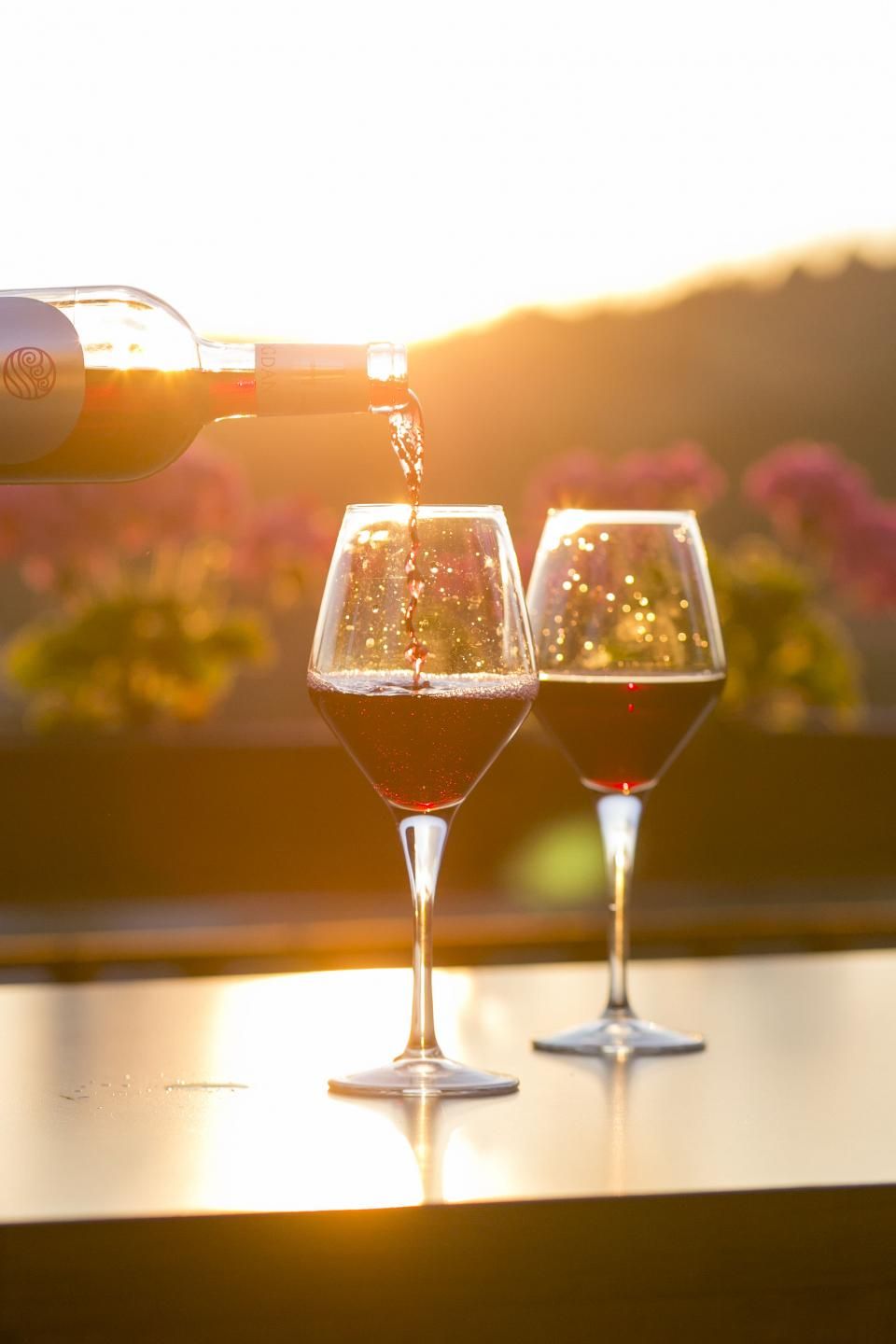 Wine glasses and bottles on the counter